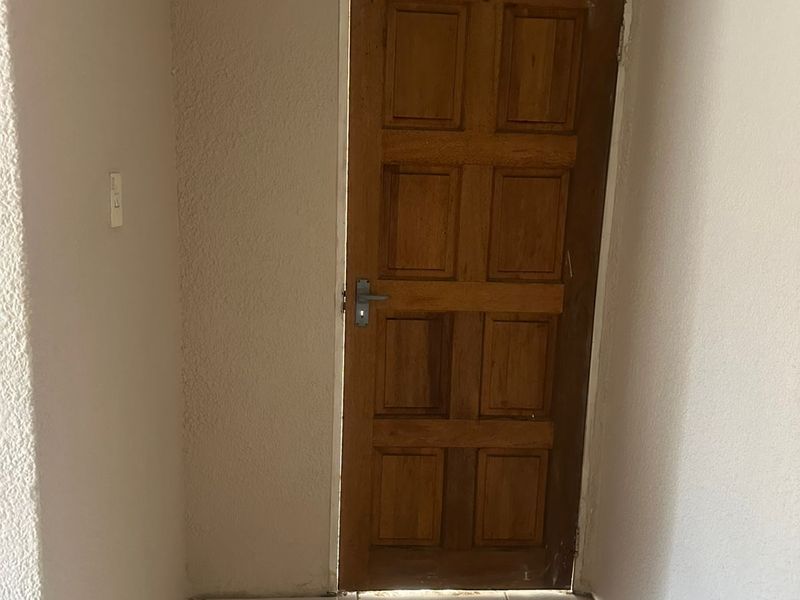 Cozy bedroom in a tranquil neighborhood, featuring ample natural light and modern amenities awaits - Photo 6