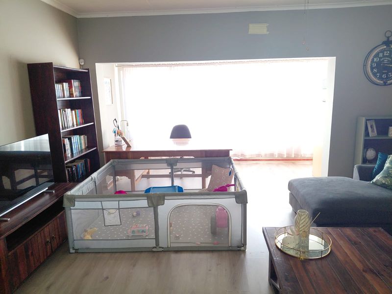 Spacious Family Home with Braai Room & Pool in Quiet Bothasrus - Photo 9