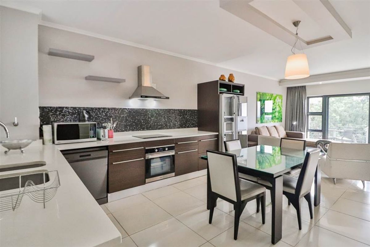 Set in the heart of Sandton, this stylish apartment blends modern comfort and convenience. - Photo 2