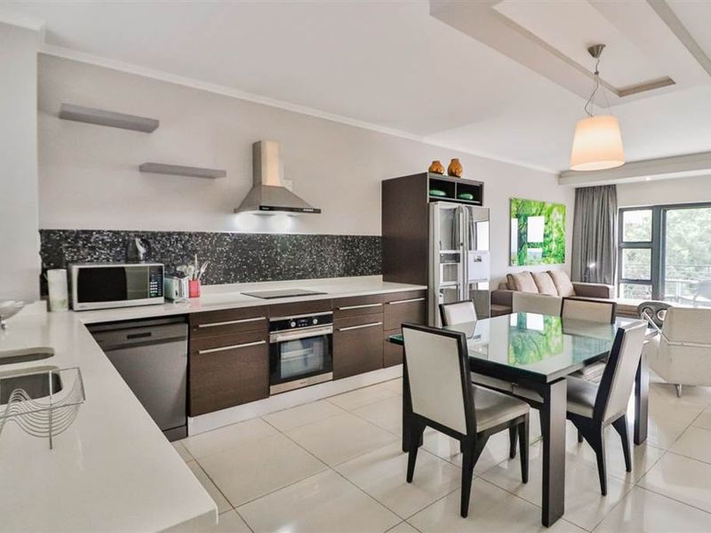 Set in the heart of Sandton, this stylish apartment blends modern comfort and convenience. - Photo 2