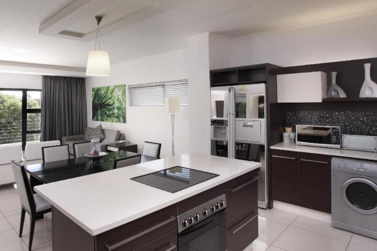 Set in the heart of Sandton, this stylish apartment blends modern comfort and convenience. - Photo 3