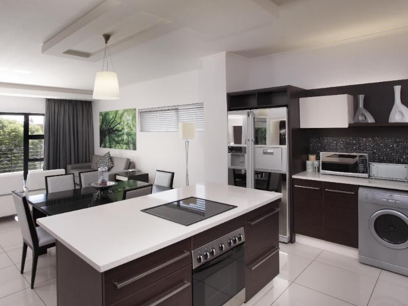 Set in the heart of Sandton, this stylish apartment blends modern comfort and convenience. - Photo 3