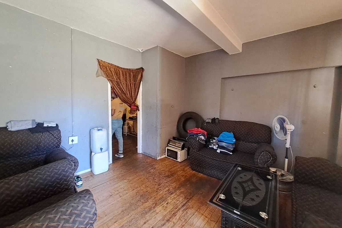 Spacious 5-Bedroom Home with Braai Area and Room to Grow - Photo 4