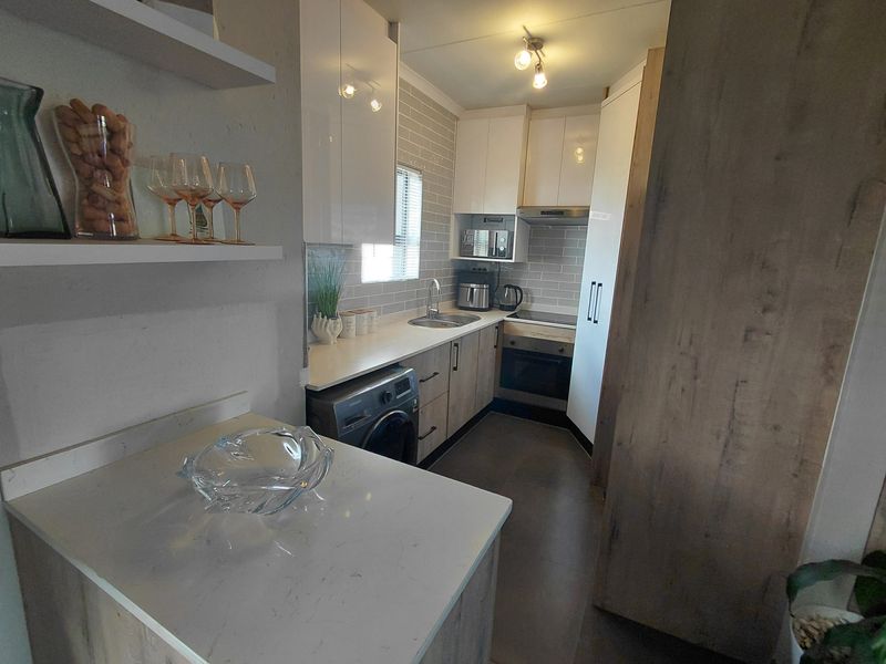 Don't Miss This Stunning 2 Bedroom and 2 Bathroom With A Stunning Balocony With A Built In Braai - Photo 3