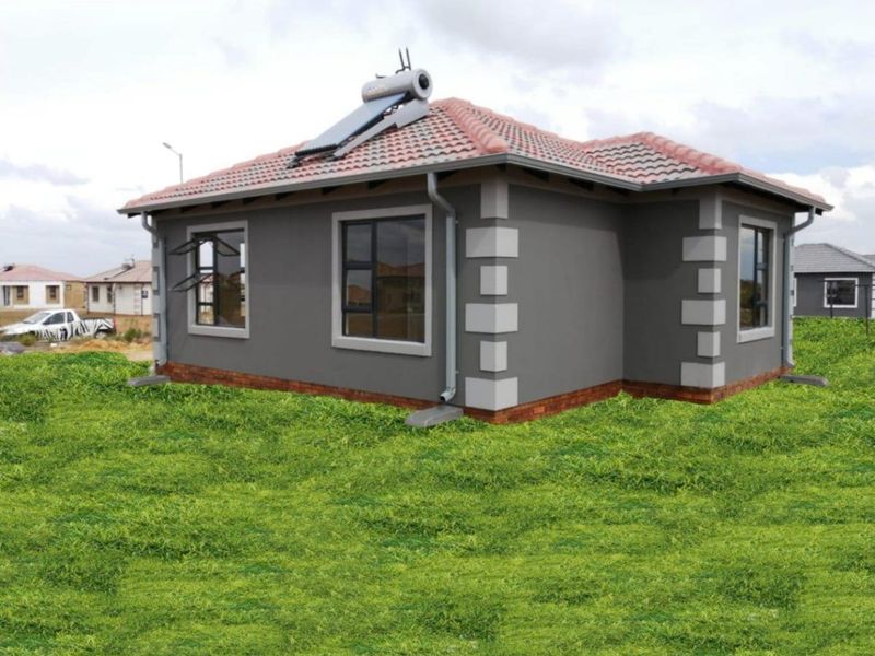 A modern single-story residential house featuring a tiled roof, solar water heating system, and grey exterior walls with contrasting corner detailing.