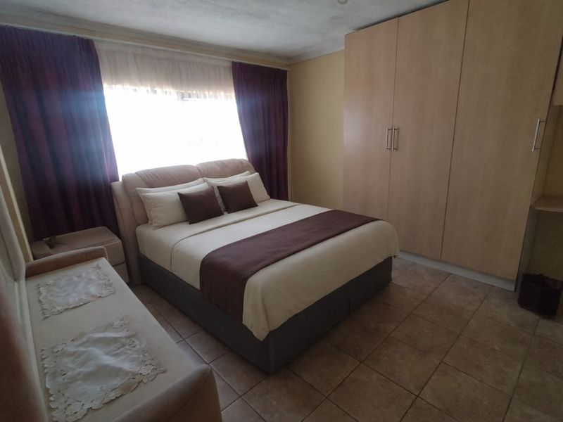 Spacious Family Home with Borehole, Fruit Trees and Excellent Outdoor Living in The Orchards - Photo 7