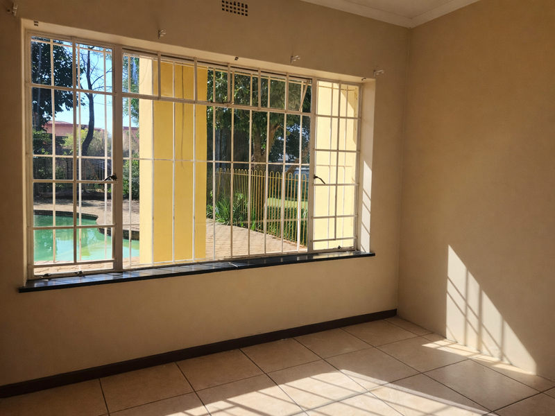 Neat secure 4Bed 3bath Home with Study sparkling pool and ample parking in Witpoortjie-1 April 2026 - Photo 9