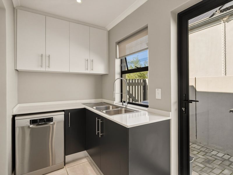 Modern Family Living with Solar in Secure Estate | Move-In Ready - Photo 6