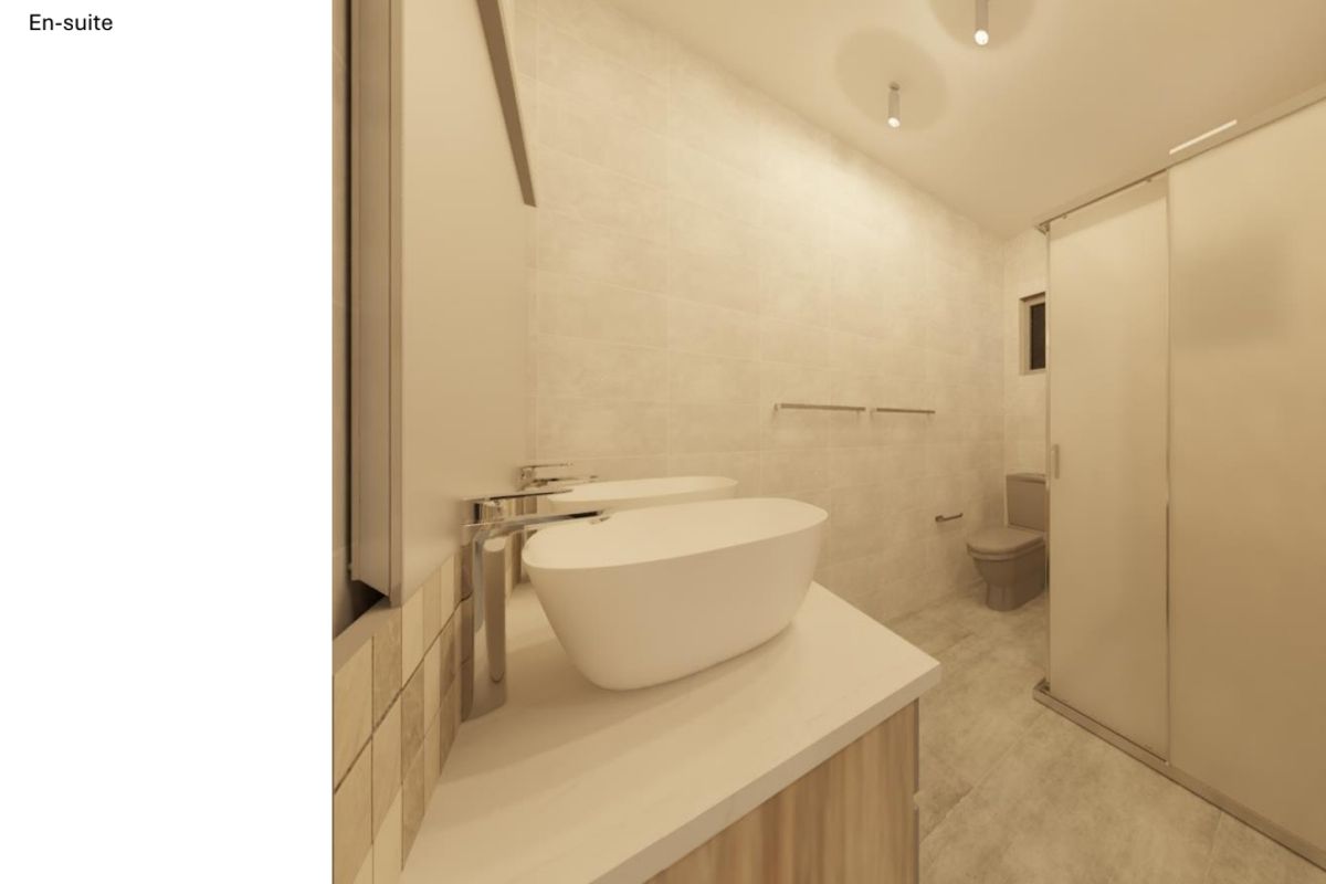 A modern en-suite bathroom featuring a double vanity with vessel sinks, a walk-in shower, and contemporary wall-mounted fixtures.