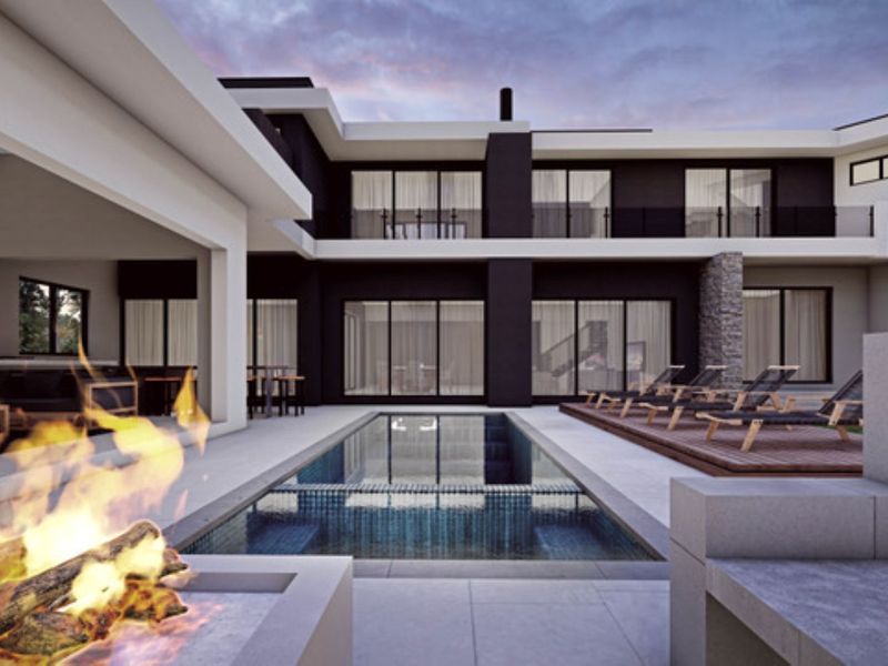 Modern luxury residence featuring a sleek swimming pool, integrated fire pit area, and expansive covered patio, showcasing contemporary architectural design and high-end finishes.