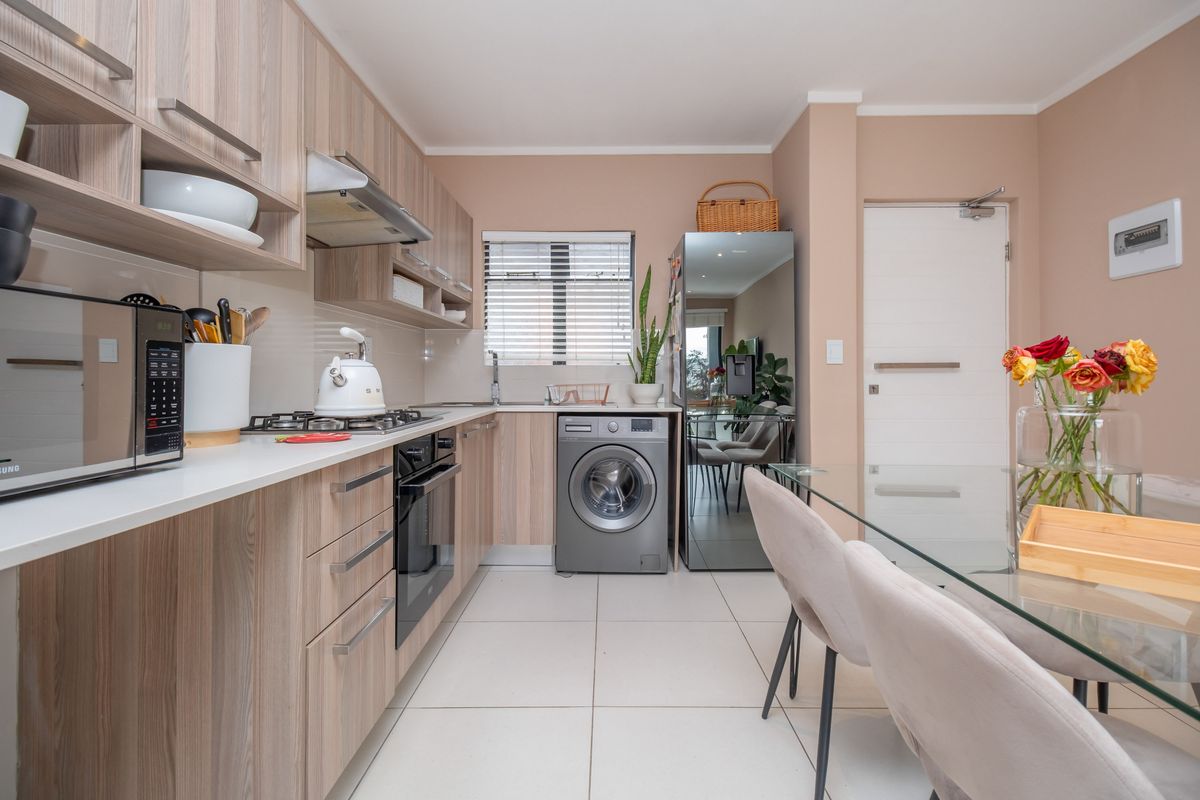 Ground-floor ease. Private garden living. Effortless convenience. - Photo 4