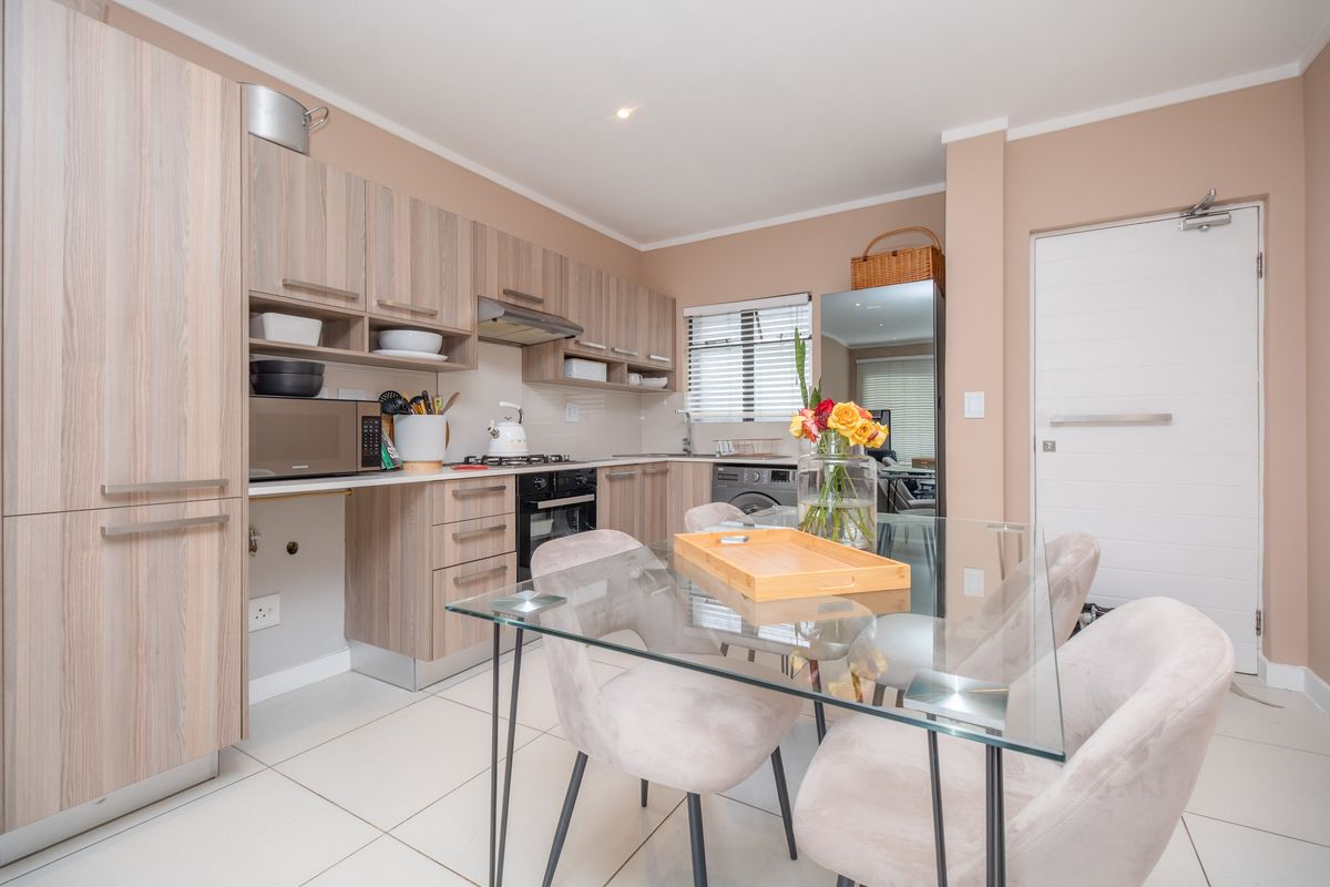 Ground-floor ease. Private garden living. Effortless convenience. - Photo 3