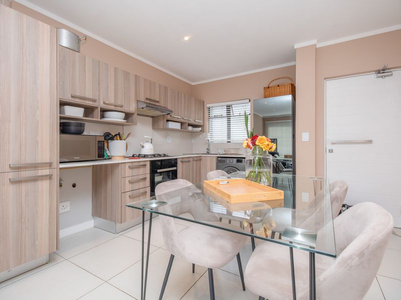 Ground-floor ease. Private garden living. Effortless convenience. - Photo 3