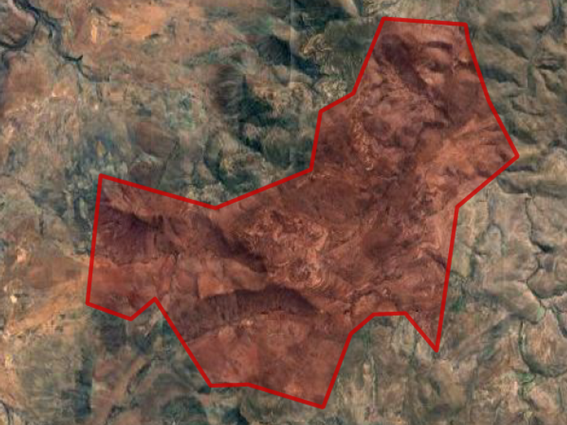 An aerial satellite view showing the demarcated boundary of the farm property within the surrounding landscape.