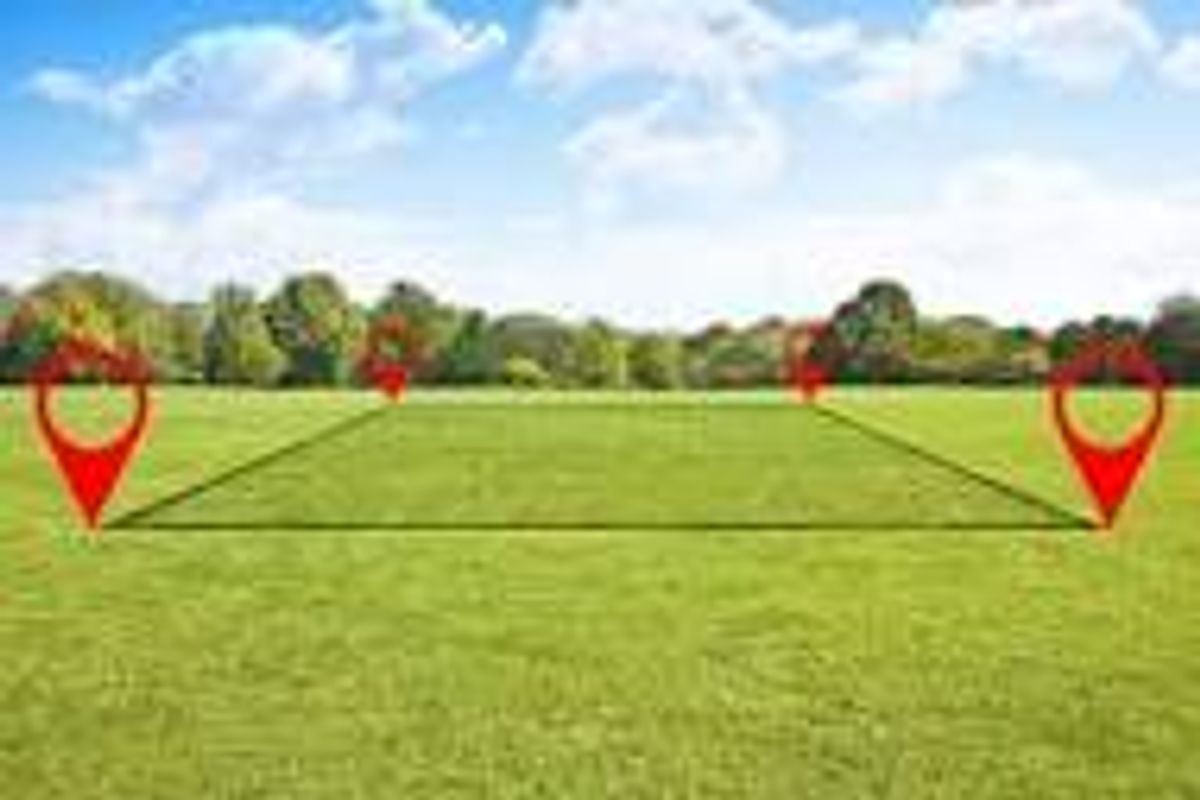 A clear, level residential vacant land plot featuring open green space, ideal for new construction.