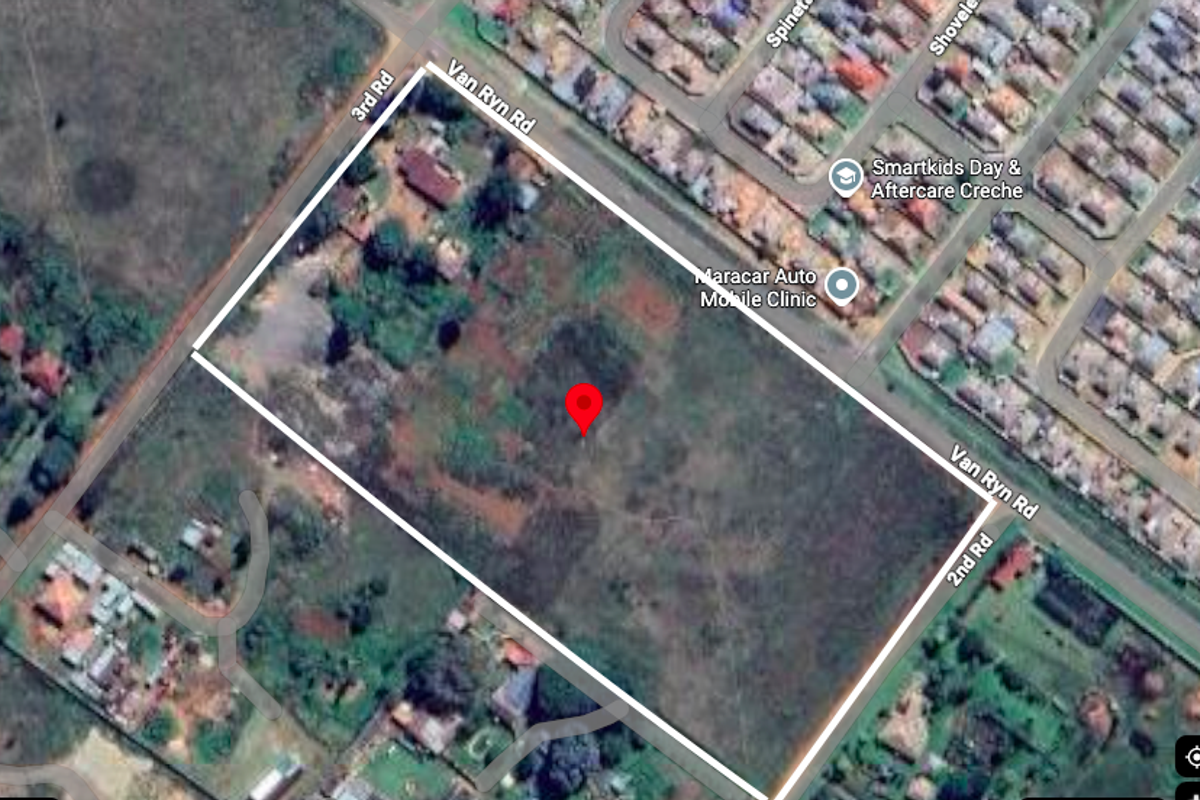 Aerial view of a large, vacant residential plot situated at the corner of Van Ryn Road, 3rd Road, and 2nd Road.