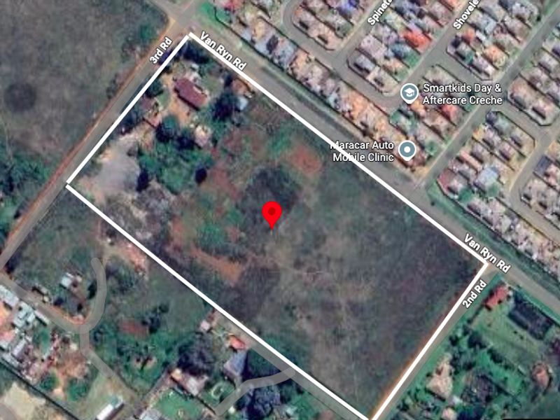 Aerial view of a large, vacant residential plot situated at the corner of Van Ryn Road, 3rd Road, and 2nd Road.