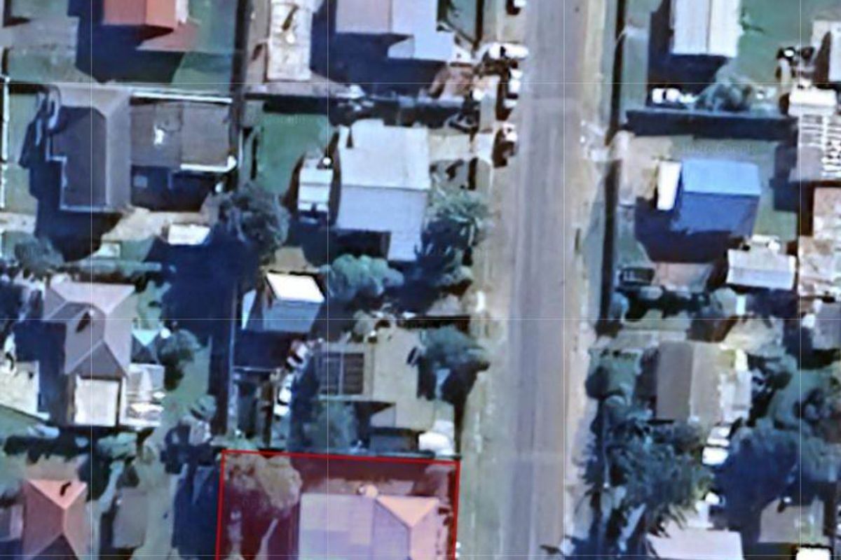 An aerial satellite view showing the property layout, roof structure, and surrounding residential neighborhood context.