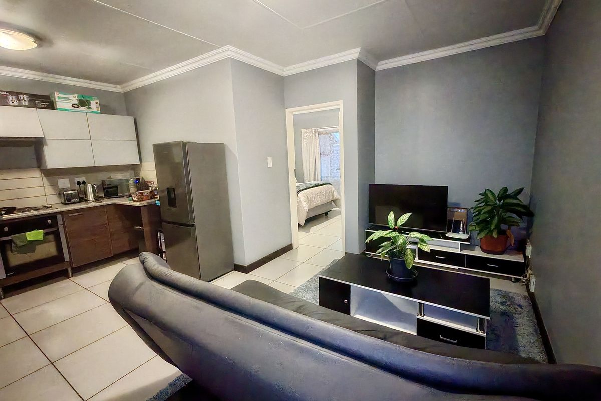 Investor’s Dream – Top-Floor Unit with Strong Appeal - Photo 2