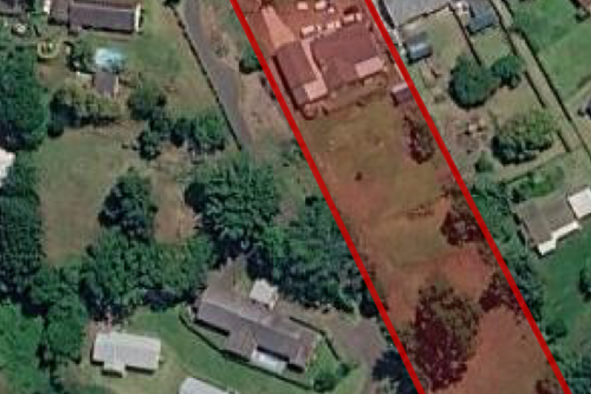 An aerial view of the property highlighting the extensive land size and the positioning of the main residential dwelling on the plot.