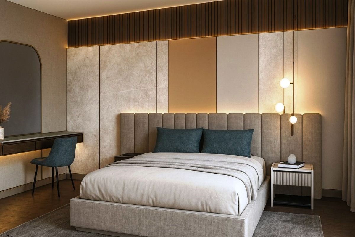 A modern, elegantly designed bedroom featuring custom upholstered headboard, integrated wall paneling, recessed accent lighting, and a sleek built-in vanity area.