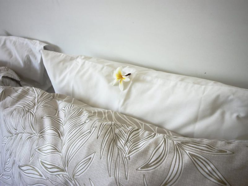 A close-up view of bedding in a bedroom setting.