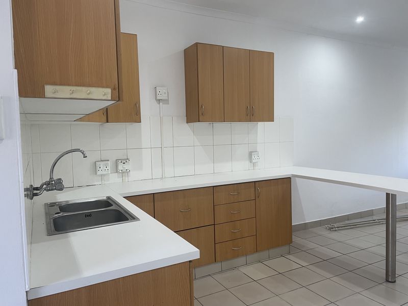 Three Bedroom Unit in Sought after Area - Photo 3