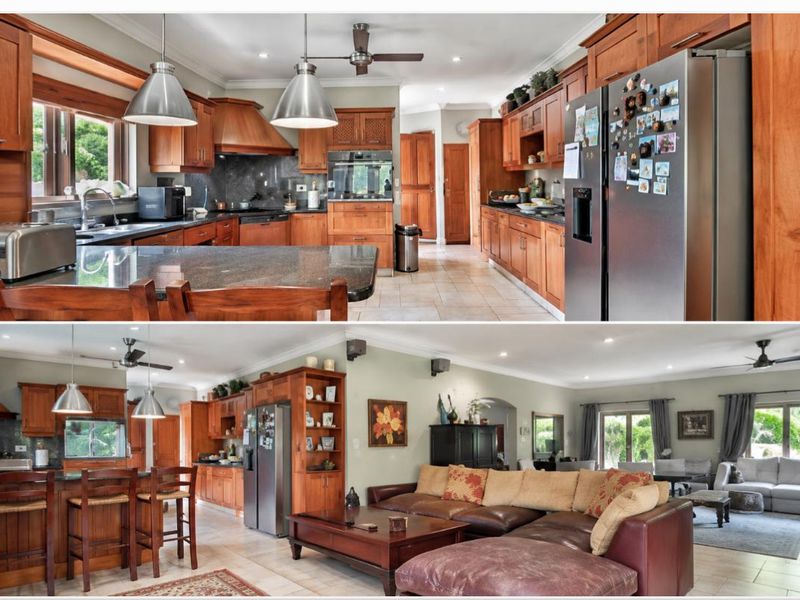 Spacious open-plan kitchen and living area featuring warm wooden cabinetry, granite countertops, a breakfast bar, and tiled flooring throughout.