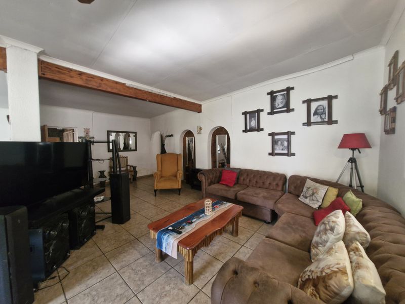 Spacious Family Home with Practical Living Spaces and Endless Potential - Photo 1
