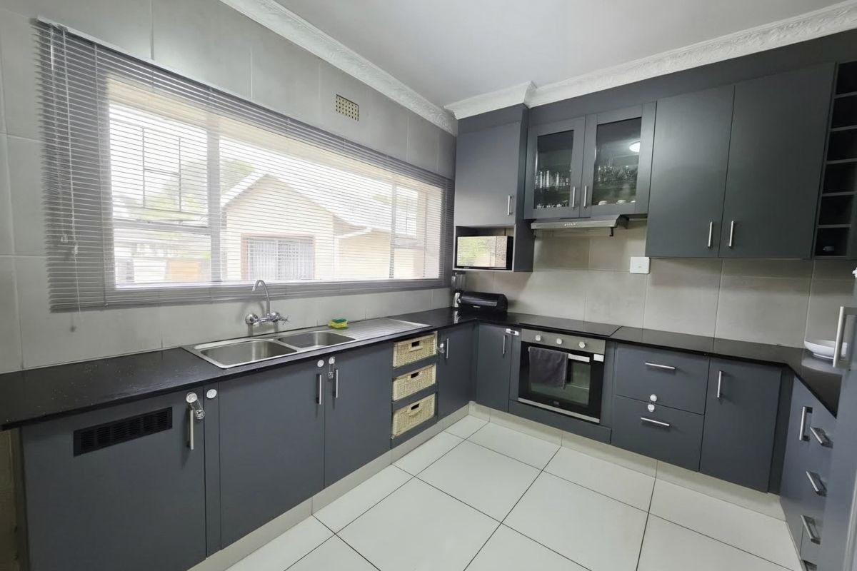 Spacious Family Home with Income-Generating Flatlet - Photo 2