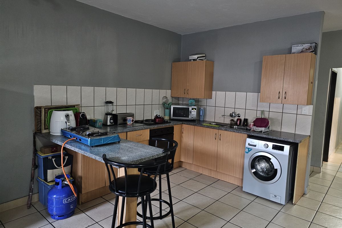 Enjoy comfortable living in a modern apartment located within a secured Estate - Photo 4
