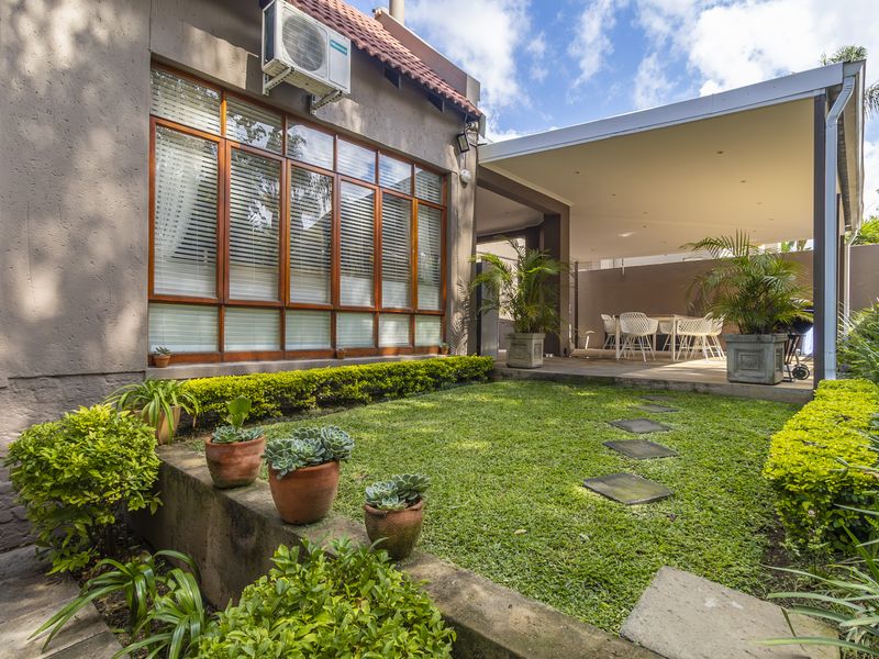 Beautifully Maintained Home with multigenerational living flexibility- self contained flatlet - Photo 4
