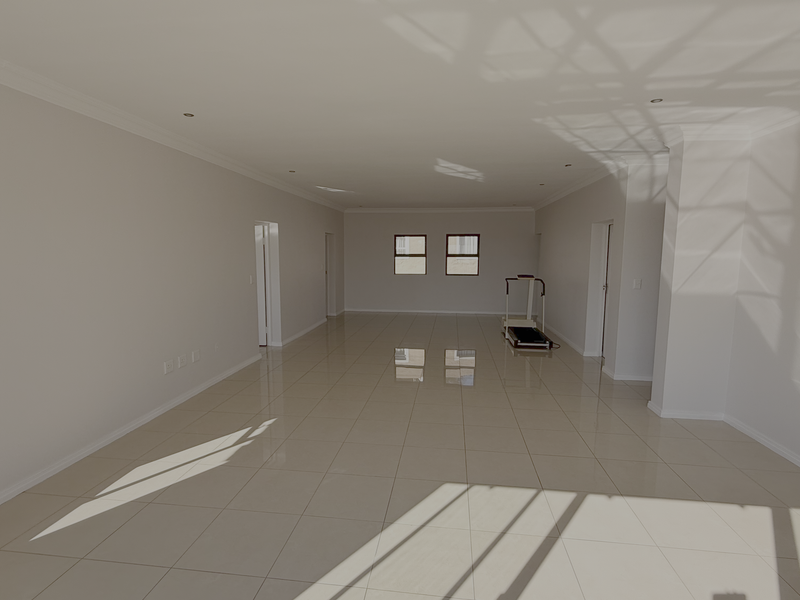 Spacious, light-filled open-plan living area featuring neutral walls, polished tiled flooring, and recessed downlighting throughout.