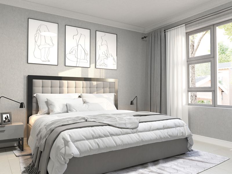 A well-lit, modern bedroom featuring neutral tones, clean lines, and large windows allowing for natural light.