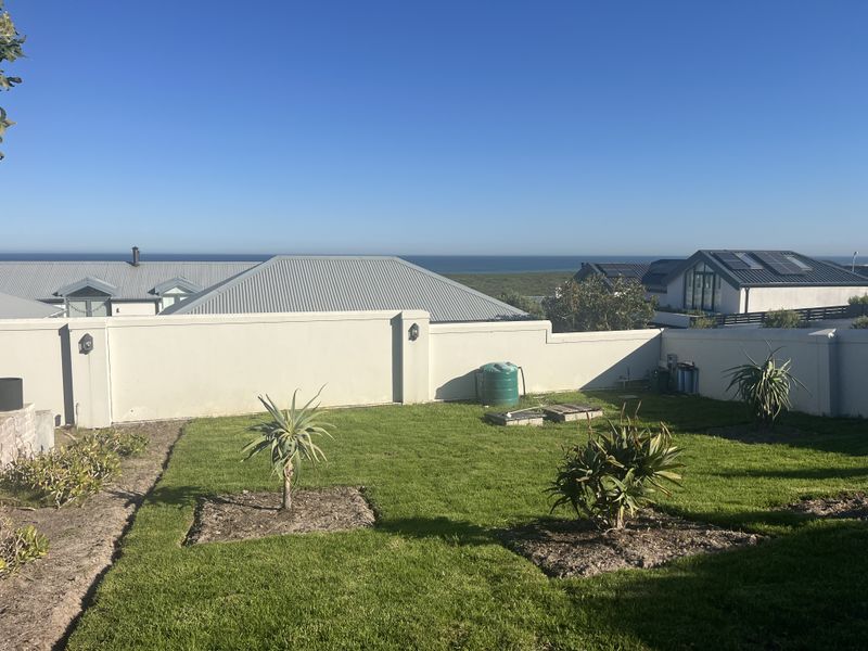 Elevated Family Home with Spectacular Ocean & Fynbos Views in Atlantic Beach Golf Estate - Photo 3