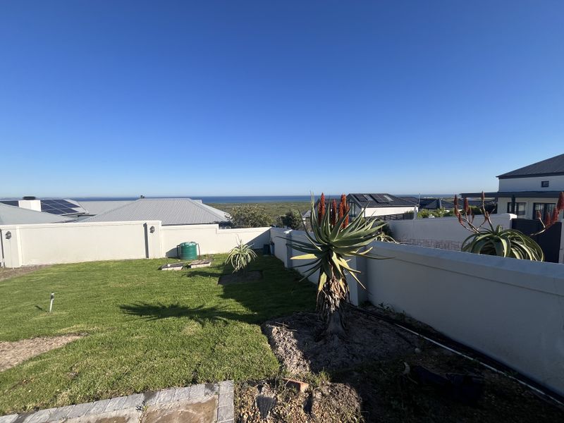 Elevated Family Home with Spectacular Ocean & Fynbos Views in Atlantic Beach Golf Estate - Photo 4