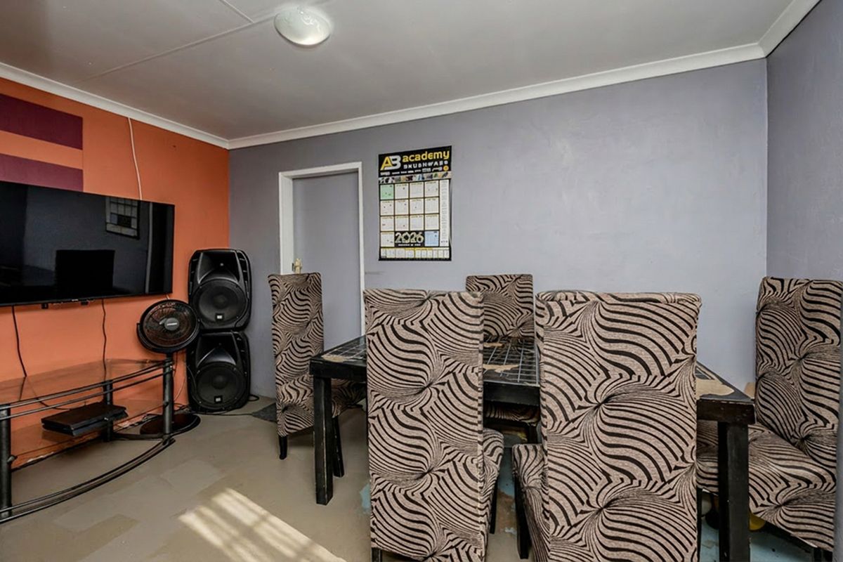 A living area featuring painted walls and standard flooring, suitable for modernization and interior design updates.