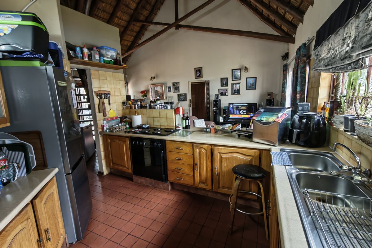 Thatch Roof Charm Meets Practical Family Living - Photo 5