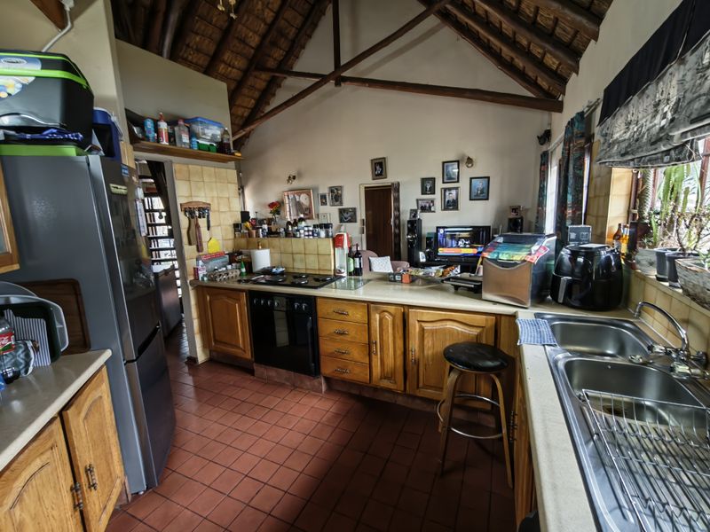 Thatch Roof Charm Meets Practical Family Living - Photo 5