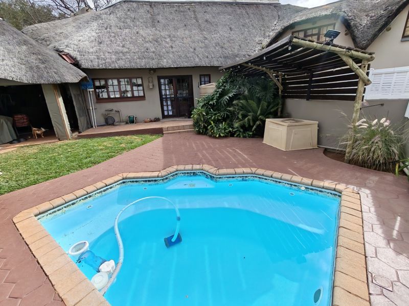 Thatch Roof Charm Meets Practical Family Living - Photo 1
