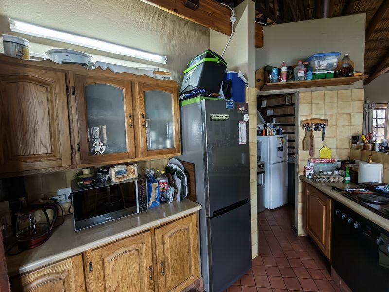 Thatch Roof Charm Meets Practical Family Living - Photo 6