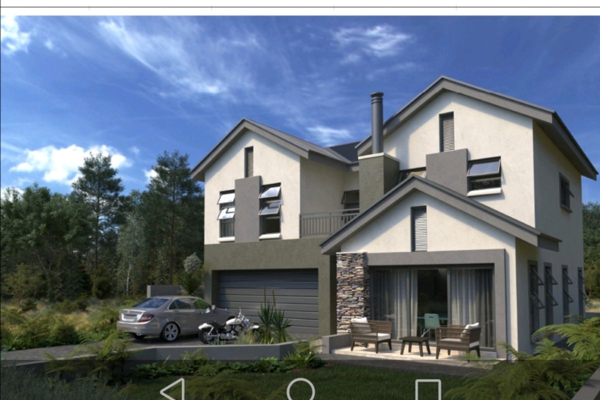 A modern two-story residential house featuring a stone-clad facade, double garage, and a covered patio area.