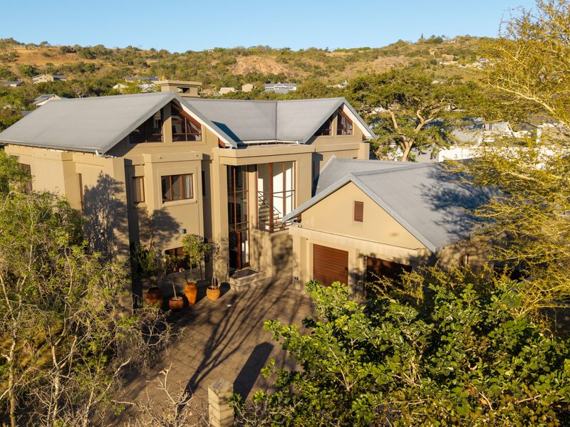 Own this sought after luxury property bordering on the greenbelt and calming stream - Photo 1