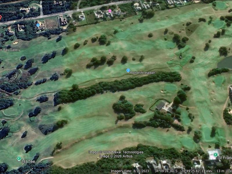 An aerial view of the surrounding golf course landscape and residential area.