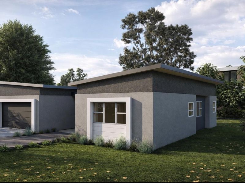 Modern cluster home exterior featuring a clean facade, skillion roof design, and an integrated garage with a paved driveway.