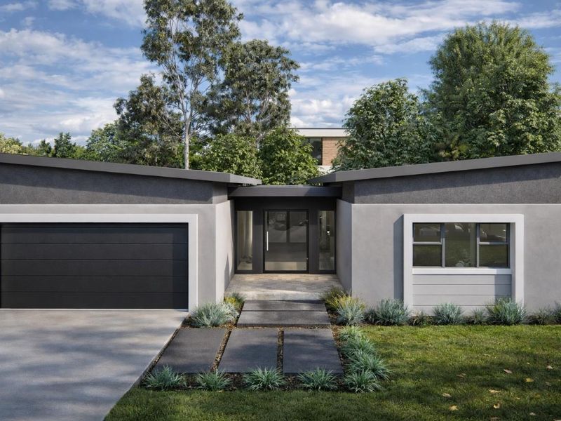 Modern front elevation of a cluster home featuring a double garage, paved walkway, and contemporary architectural design with a landscaped front garden.