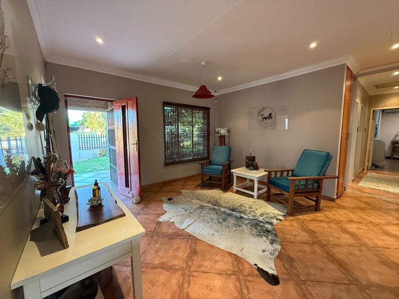 Welcoming entrance area featuring ceramic tiled flooring, recessed lighting, and direct access to the exterior garden.