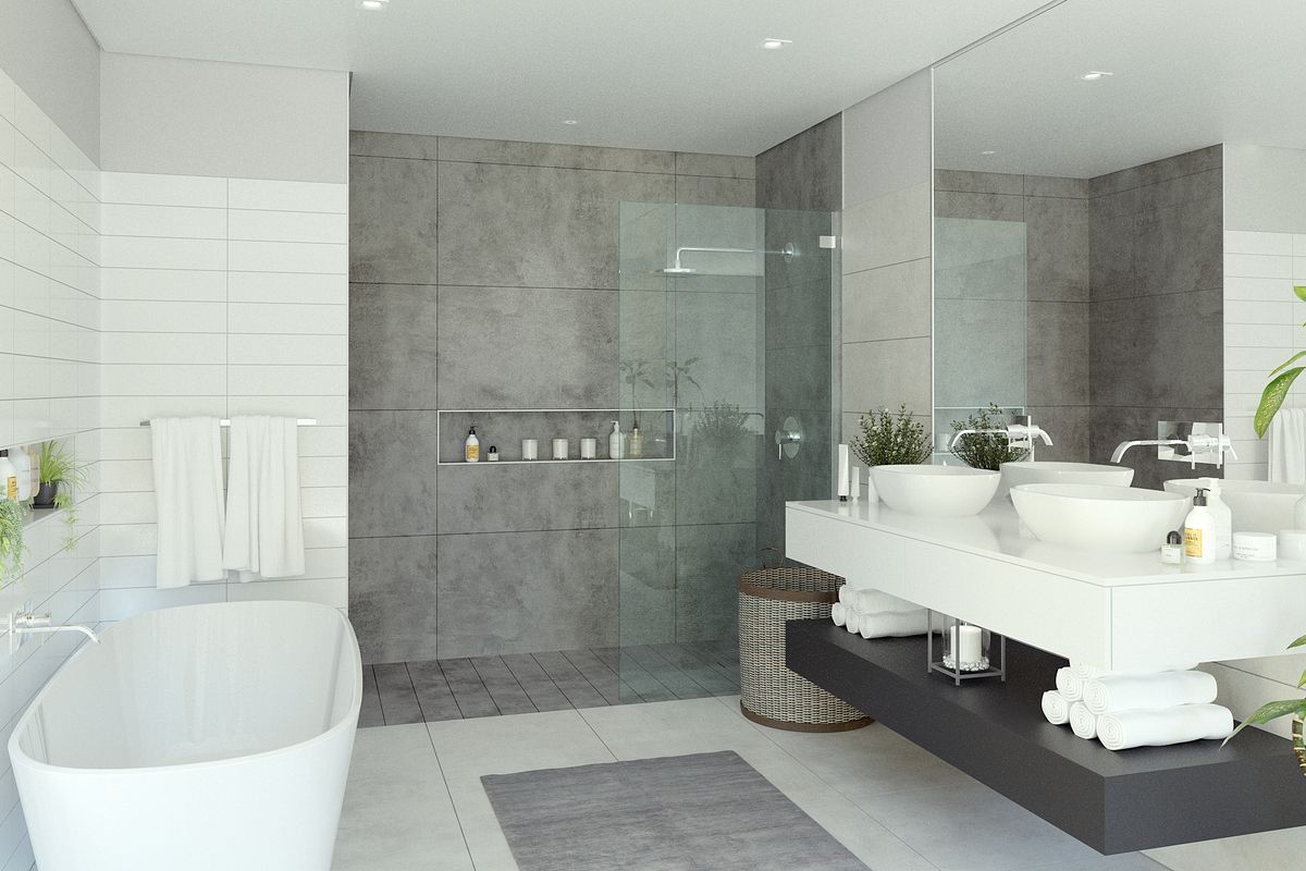 Modern, high-end bathroom featuring a sleek freestanding bathtub, a spacious walk-in shower with glass enclosure, and a contemporary double vanity with wall-mounted fixtures.