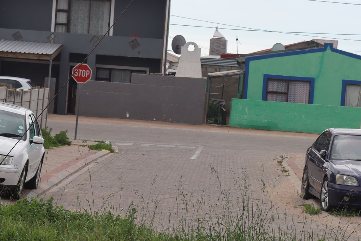 A street view showing the paved road, kerbing, and surrounding residential properties in the neighborhood.