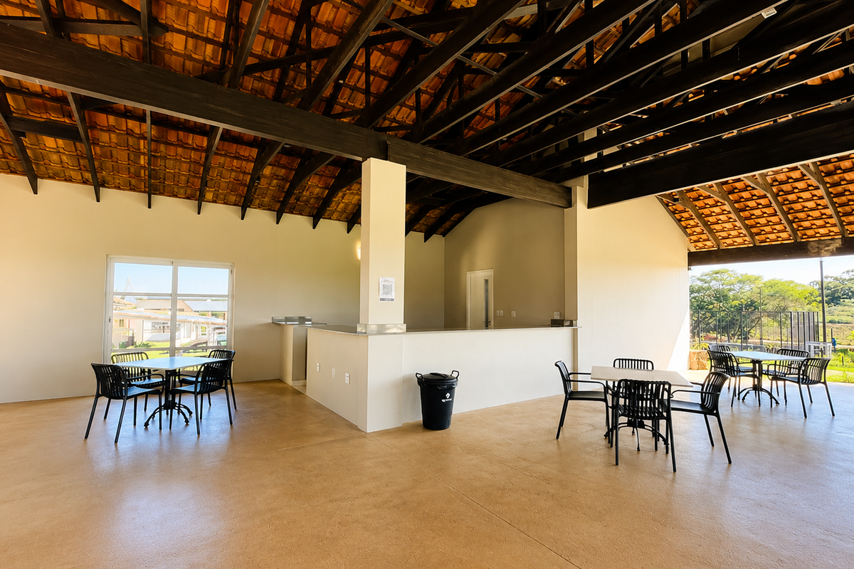 Spacious clubhouse area featuring high vaulted ceilings with exposed timber trusses, a built-in service counter, and large sliding glass doors opening to the exterior.